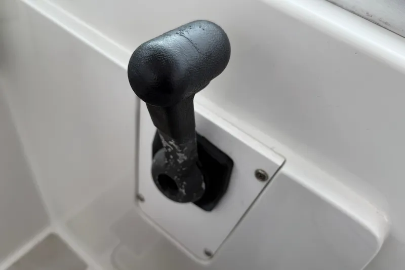 Slide: The Image of Close-up of a control lever on a 2005 Back Cove 26 boat. - 39