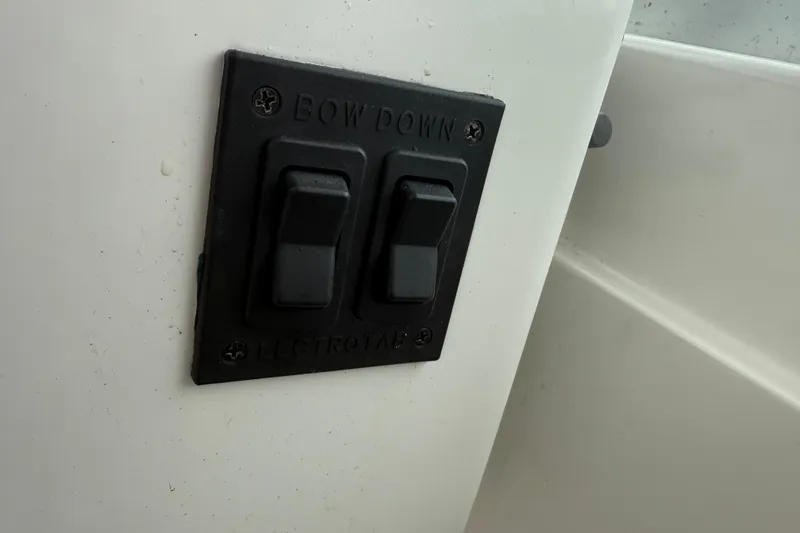 Slide: The Image of Switch panel on a 2005 Back Cove 26 boat, labeled "Bow Down." - 40
