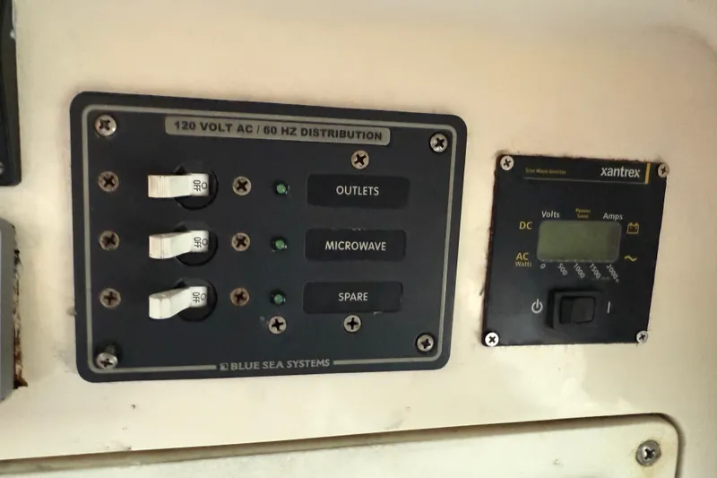 Slide: The Image of Electrical panel on 2005 Back Cove 26 boat with Blue Sea Systems and Xantrex inverter. - 59