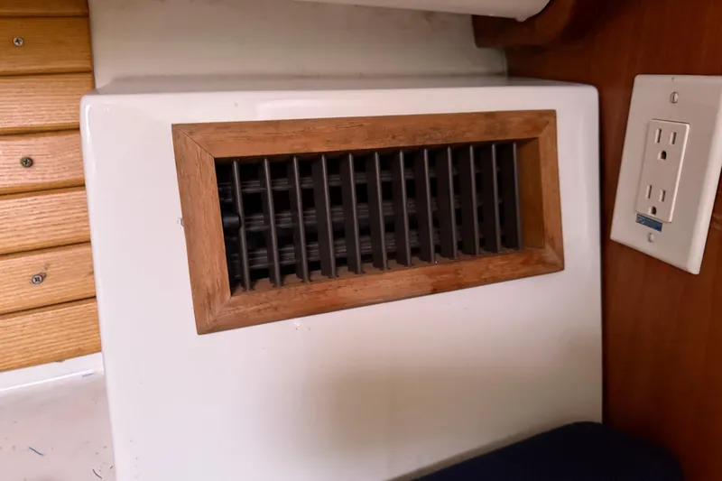 Slide: The Image of Vent and electrical outlet on 2005 Back Cove 26 boat interior. - 61