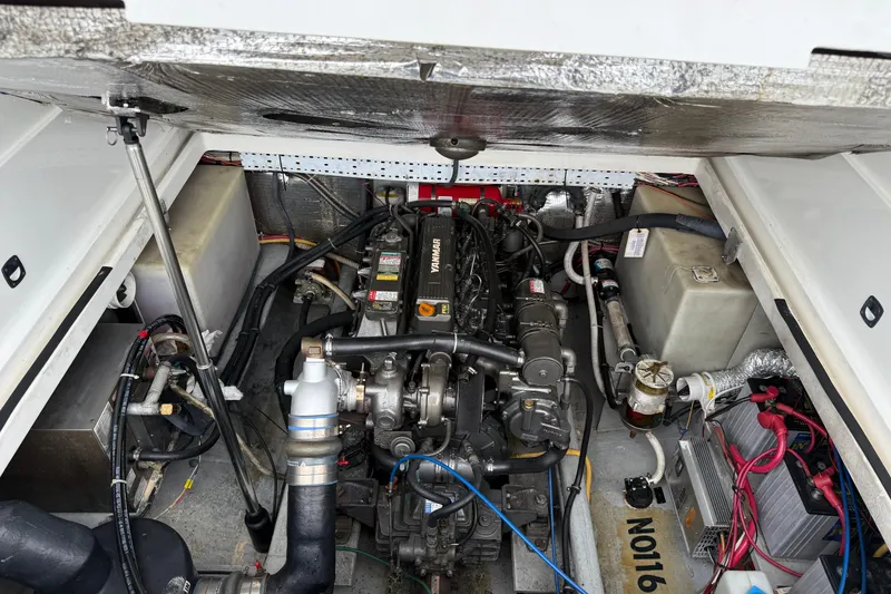 Slide: The Image of Engine compartment of a 2005 Back Cove 26 boat, featuring a Yanmar engine. - 67
