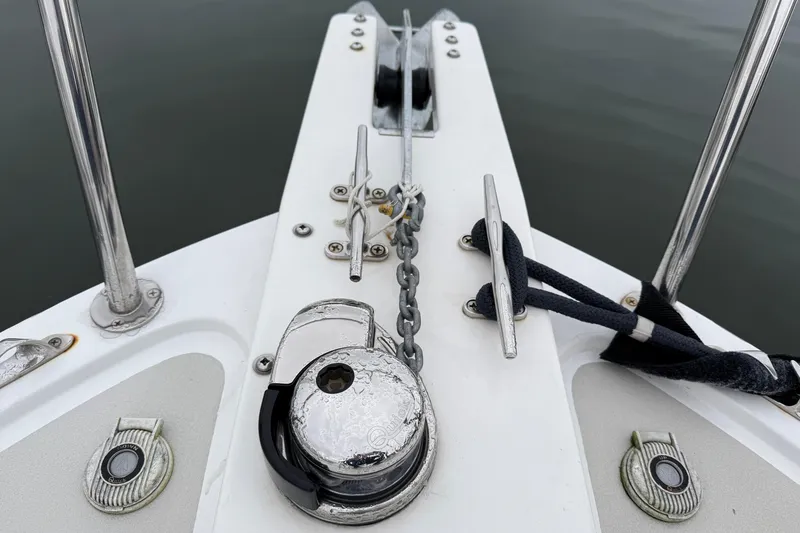 Slide: The Image of Bow of 2005 Back Cove 26 boat with anchor chain and cleats. - 7