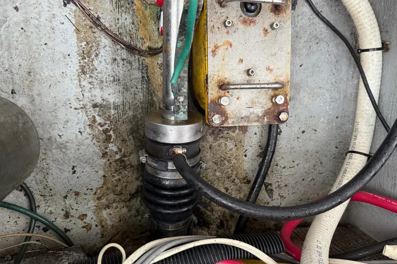 Slide: The Image of Engine compartment of a 2005 Back Cove 26 boat showing mechanical components and wiring. - 70