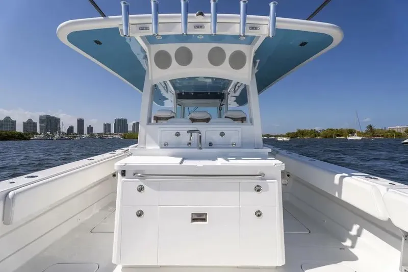 Slide: The Image of 2025 HCB 42 Lujo boat interior with sleek design and city skyline in background. - 24