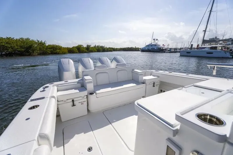 Slide: The Image of 2025 HCB 42 Lujo boat interior with luxurious seating and scenic marina view. - 31