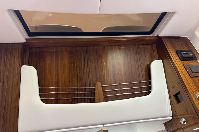 Slide: The Image of Interior of 2025 HCB 42 Lujo boat with wood paneling and modern design elements. - 34