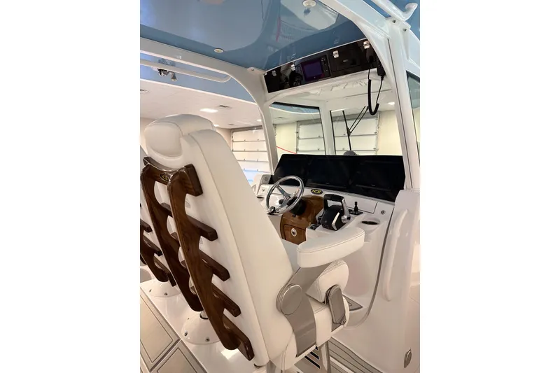 Slide: The Image of 2025 HCB 42 Lujo boat interior with luxurious helm and seating. - 39