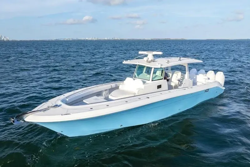 Slide: The Image of 2025 HCB 42 Lujo boat cruising on open water, showcasing sleek design and powerful engines. - 4