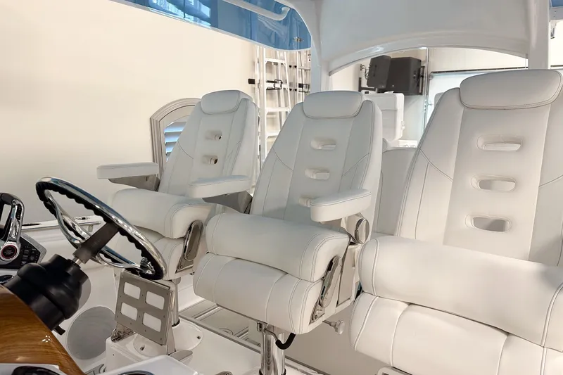 Slide: The Image of Luxurious white seating in 2025 HCB 42 Lujo boat cockpit. - 44