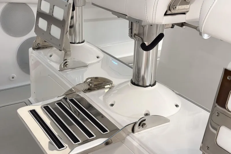 Slide: The Image of 2025 HCB 42 Lujo boat interior with stainless steel and white leather seating. - 46