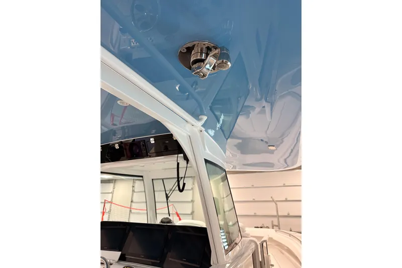 Slide: The Image of 2025 HCB 42 Lujo boat interior with blue ceiling and modern controls. - 50