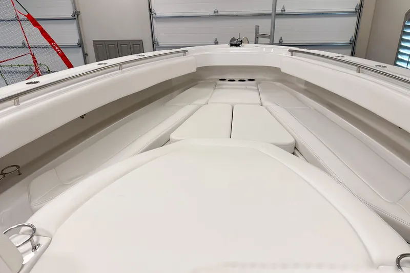 Slide: The Image of Interior view of 2025 HCB 42 Lujo boat, showcasing sleek white seating and modern design. - 51