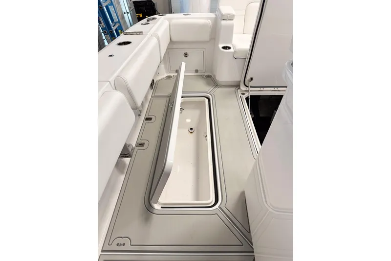 Slide: The Image of 2025 HCB 42 Lujo boat interior with open storage compartment, showcasing sleek design. - 52