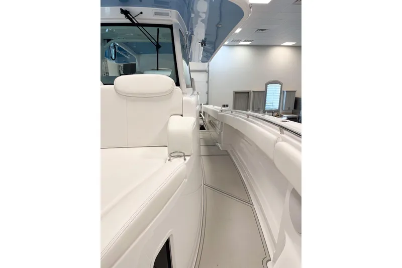 Slide: The Image of 2025 HCB 42 Lujo boat interior with sleek white seating and modern design. - 53