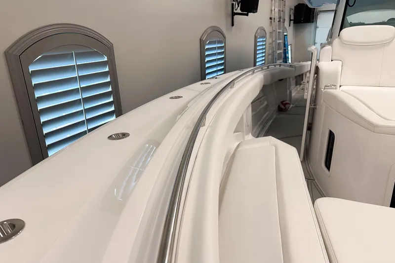 Slide: The Image of 2025 HCB 42 Lujo boat interior with sleek white seating and modern design. - 61