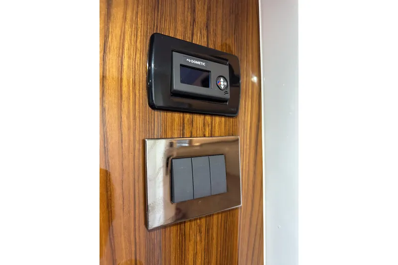 Slide: The Image of Control panel and switches on HCB 42 Lujo 2025 yacht interior. - 65