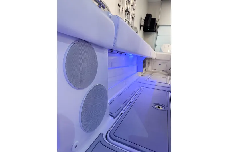 Slide: The Image of Interior of 2025 HCB 42 Lujo boat with blue LED lighting and speakers. - 66