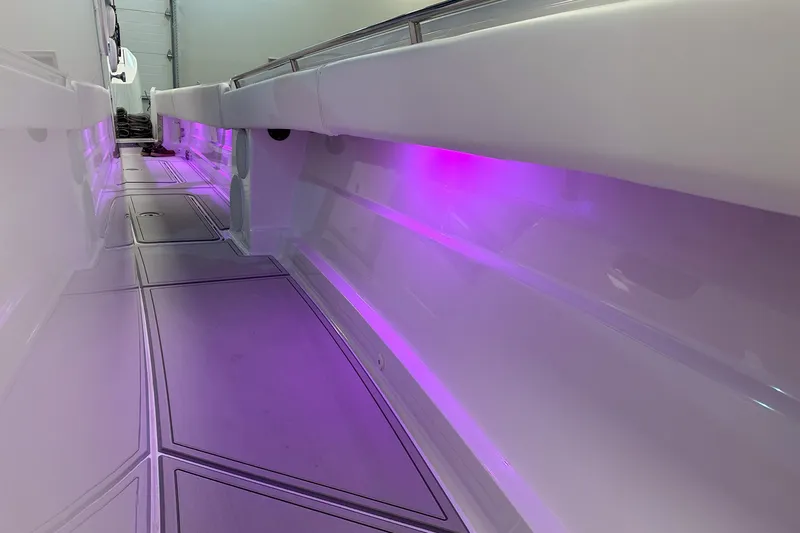 Slide: The Image of 2025 HCB 42 Lujo boat interior with purple LED lighting. - 71