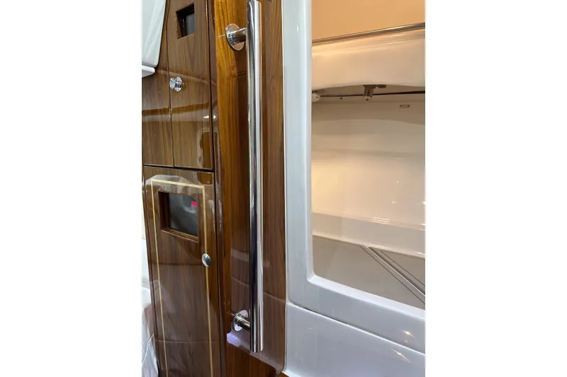Slide: The Image of Interior view of 2025 HCB 42 Lujo boat, featuring sleek wood paneling and modern design. - 72
