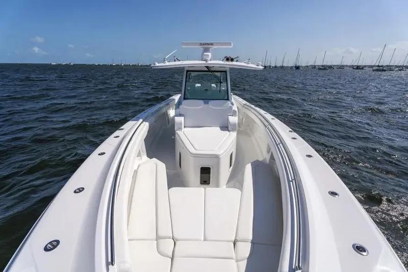 Slide: The Image of 2025 HCB 42 Lujo boat on open water, showcasing sleek design and spacious deck. - 8
