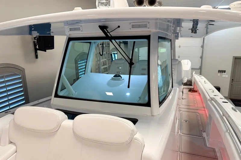 Slide: The Image of 2025 HCB 42 Lujo boat interior with modern design and white seating. - 80