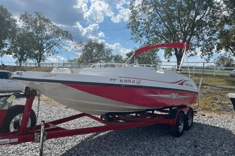 Slide: The Image of Red and white 2008 Spectra 2040 boat on trailer, parked outdoors under a blue sky. - 3