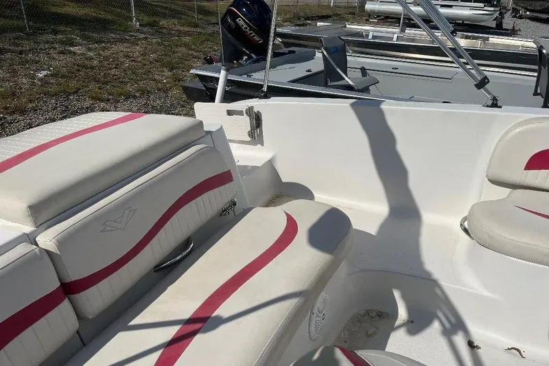 Slide: The Image of Interior of a 2008 Spectra 2040 boat with white and pink seating. - 5