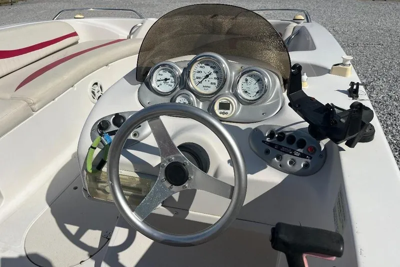 Slide: The Image of Steering console of a 2008 Spectra 2040 boat with gauges and controls. - 6