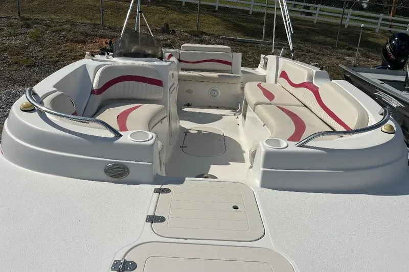 Slide: The Image of 2008 Spectra 2040 boat interior with white and red seating, open deck layout. - 7
