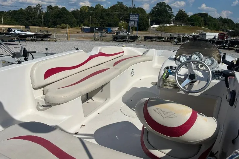 Slide: The Image of Interior of a 2008 Spectra 2040 boat with red and white seating. - 9