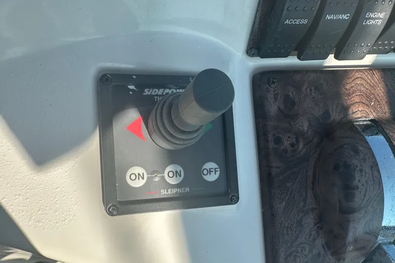 Slide: The Image of Interior view of 2000 Doral 360 SE boat cockpit with steering wheel and controls. - 10