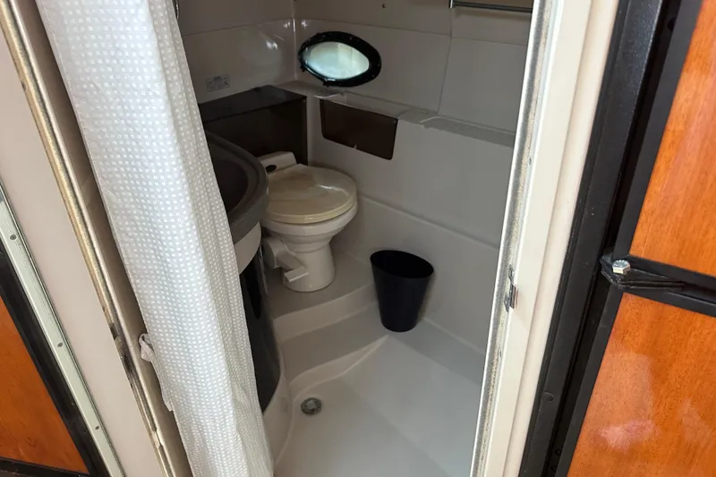 Slide: The Image of Cockpit of 2000 Doral 360 SE boat with wood accents and navigation equipment. - 14