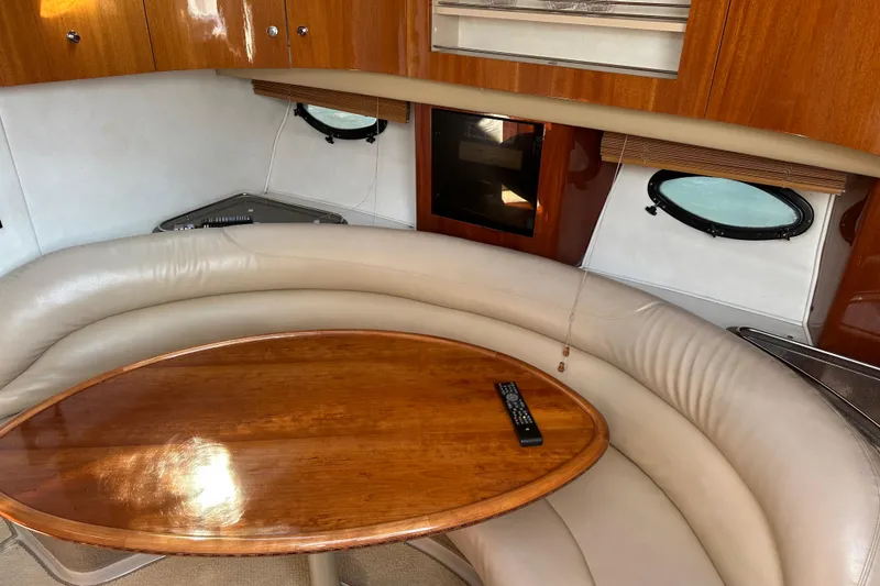 Slide: The Image of Compact bathroom in 2000 Doral 360 SE boat with toilet, sink, and porthole window. - 17