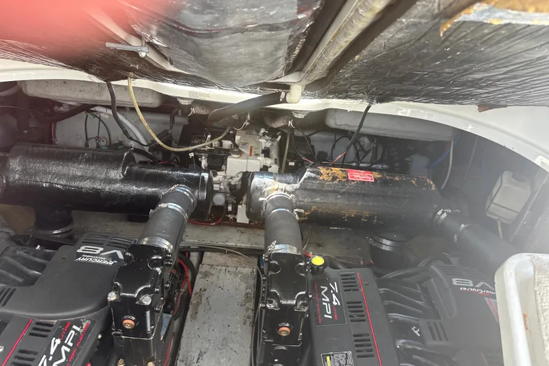 Slide: The Image of Engine compartment of a 2000 Doral 360 SE boat with dual MerCruiser V8 engines. - 25