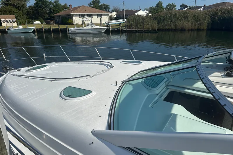 Slide: The Image of 2000 Doral 360 SE boat on dry dock under clear blue sky. - 3