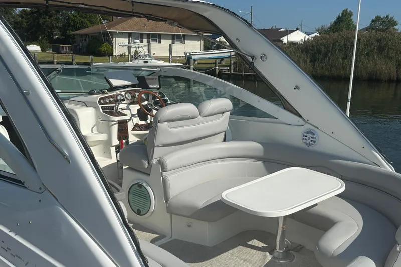 Slide: The Image of 2000 Doral 360 SE boat docked in a marina, showcasing sleek design and spacious interior. - 4