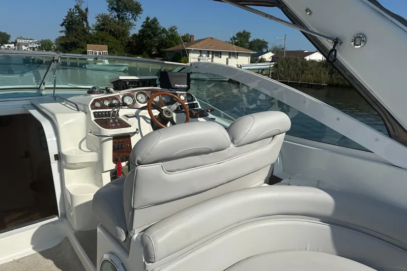 Slide: The Image of Interior of a 2000 Doral 360 SE boat with seating and steering area. - 7