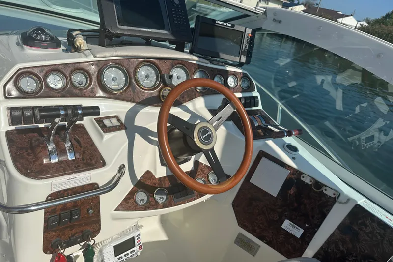 Slide: The Image of 2000 Doral 360 SE boat interior with seating, sink, and control panel. - 8