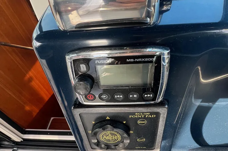 Slide: The Image of 2003 Tiara Yachts 3100 Open dashboard with navigation instruments and controls. - 10