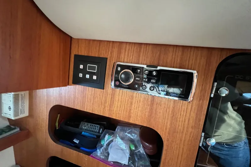 Slide: The Image of Control panel of a 2003 Tiara Yachts 3100 Open, featuring Fusion MS-NRX200 and RCL-100 Point Pad. - 12