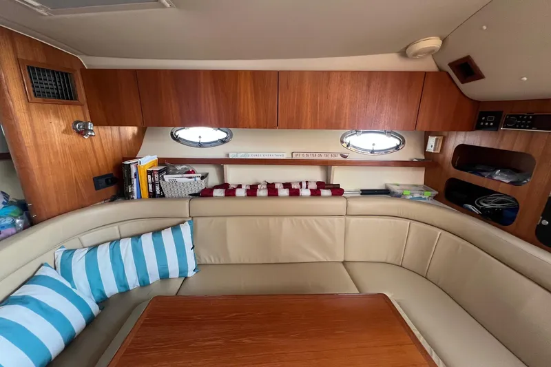 Slide: The Image of 2003 Tiara Yachts 3100 Open bathroom with sink, toilet, and storage shelves. - 17