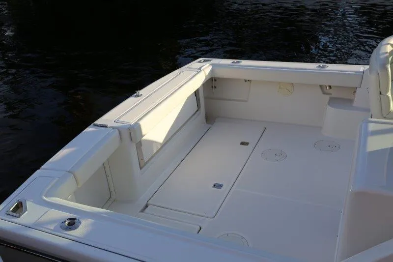 Slide: The Image of White seating on 2003 Tiara Yachts 3100 Open boat, dockside view. - 23