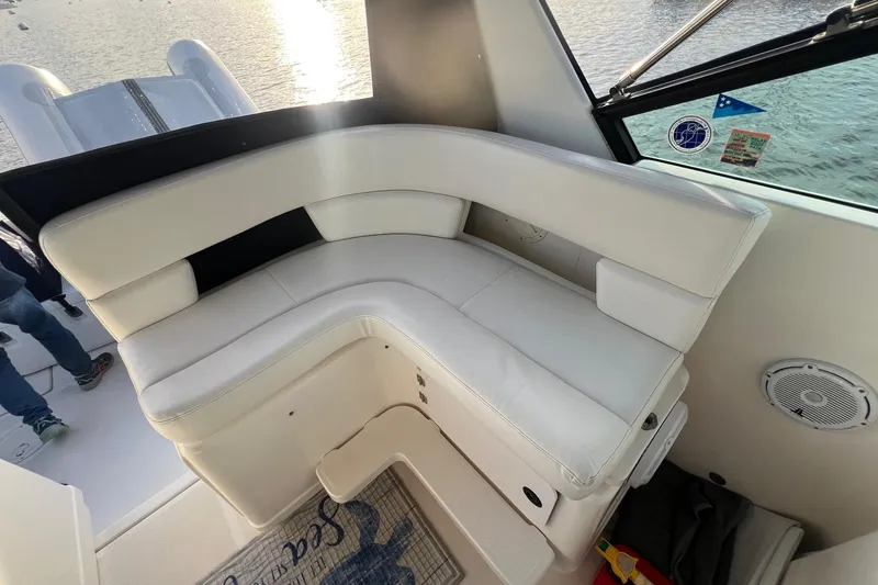 Slide: The Image of 2003 Tiara Yachts 3100 Open boat docked in a scenic harbor. - 6