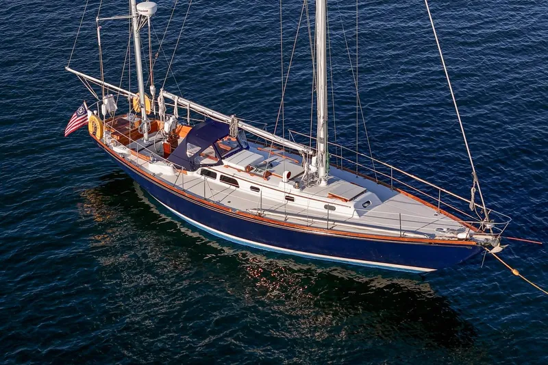 Slide: The Image of 1971 Hinckley Bermuda 40 Custom Yawl sailing on calm blue waters. - 11