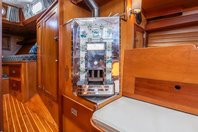 Slide: The Image of Interior of 1971 Hinckley Bermuda 40 Custom Yawl with wood paneling and stove. - 31