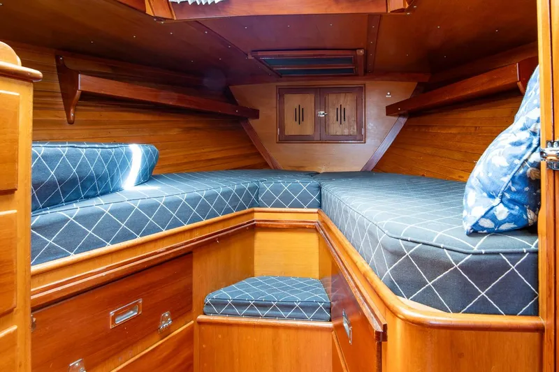Slide: The Image of Interior cabin of 1971 Hinckley Bermuda 40 Custom Yawl with wooden finish and cushioned seating. - 33