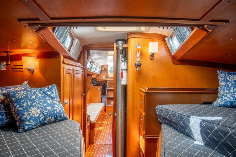 Slide: The Image of Interior of 1971 Hinckley Bermuda 40 Custom Yawl, featuring cozy wooden cabin and nautical decor. - 35