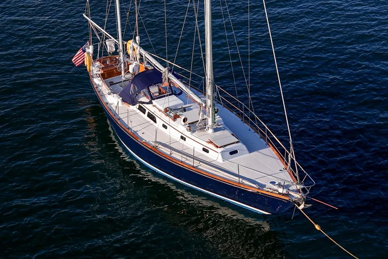 Slide: The Image of 1971 Hinckley Bermuda 40 Custom Yawl sailing on calm waters. - 10