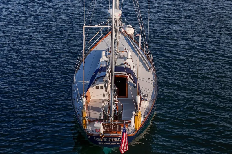 Slide: The Image of 1971 Hinckley Bermuda 40 Custom Yawl sailing on calm waters, aerial view. - 12