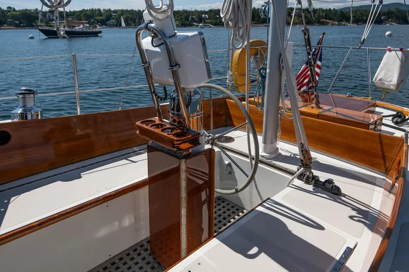 Slide: The Image of 1971 Hinckley Bermuda 40 Custom Yawl cockpit with wooden accents and steering wheel. - 22